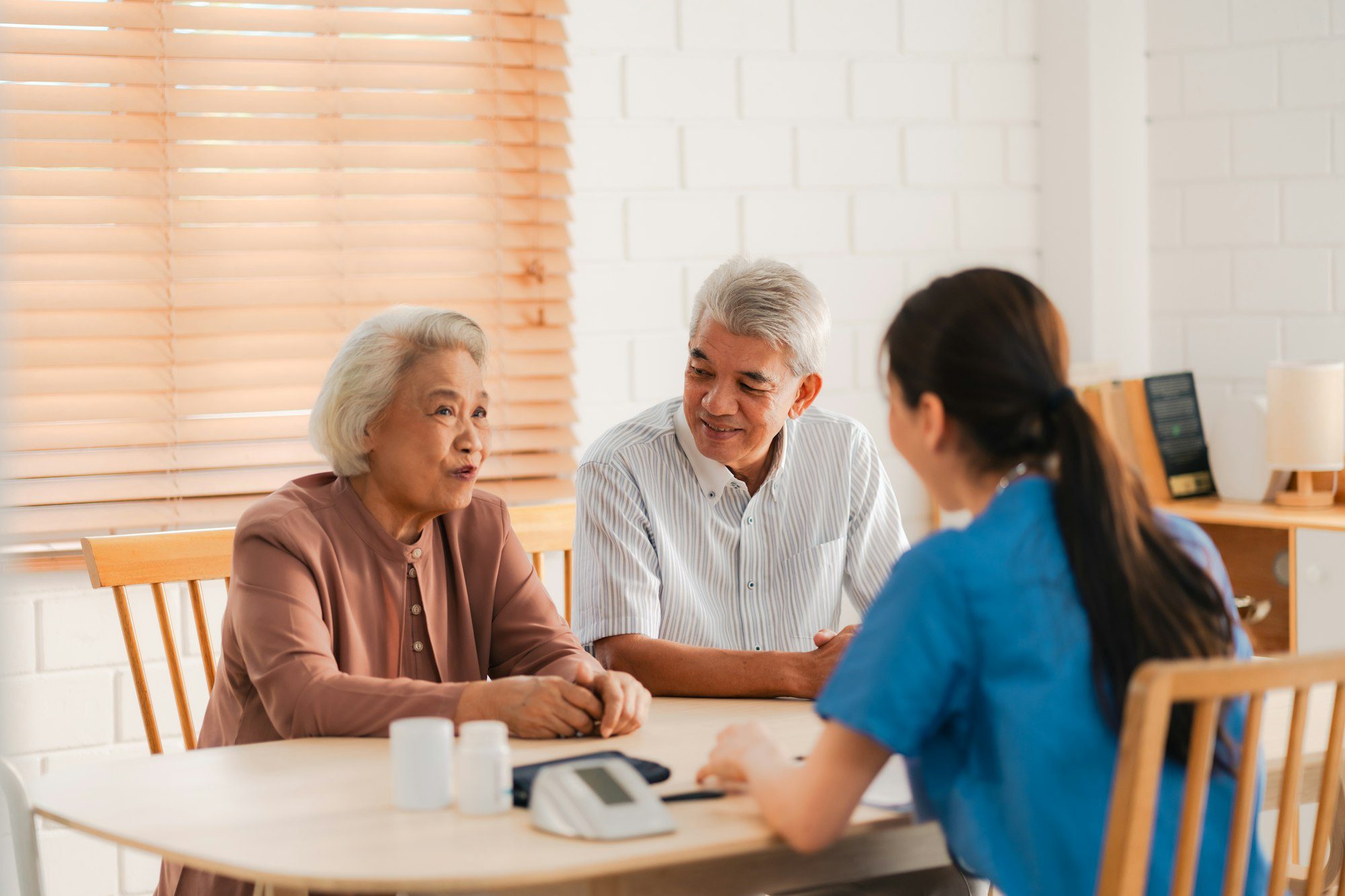 health-insurance-service-young-asian-caregiver-nurse-examine-senior-man-or-woman-patient-at-home-1.jpg